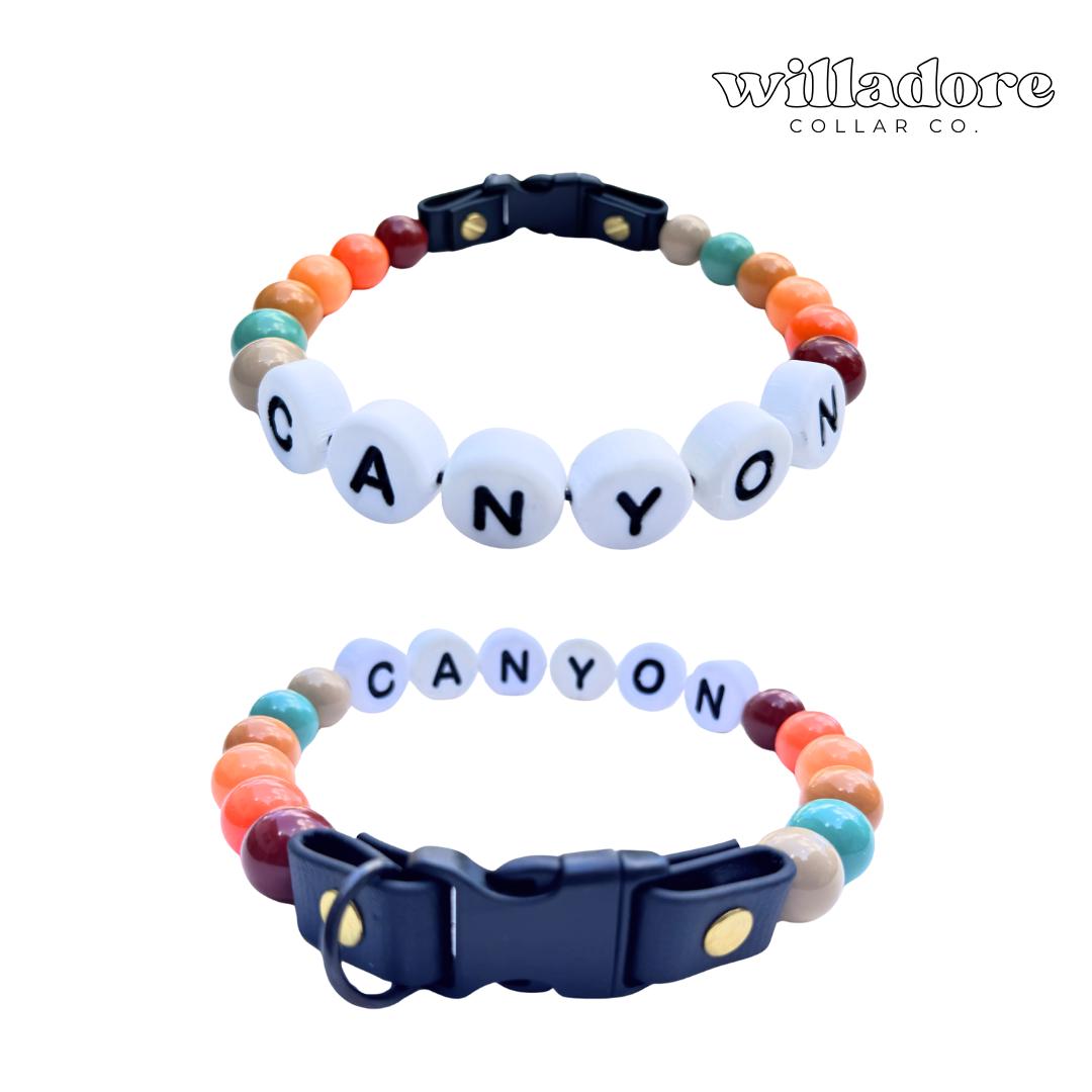 Custom beaded dog collar with canyon‑tone beads and CANYON name letters, personalized handmade pet collar by Willadore Collar Co.