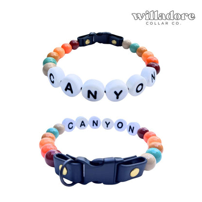 Custom beaded dog collar with canyon‑tone beads and CANYON name letters, personalized handmade pet collar by Willadore Collar Co.