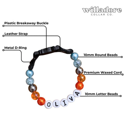 Labeled diagram of a custom beaded breakaway cat collar with multicolor beads and OLIVA name letters, showing key components and safety‑focused construction details for Willadore Collar Co.’s handmade cat collars