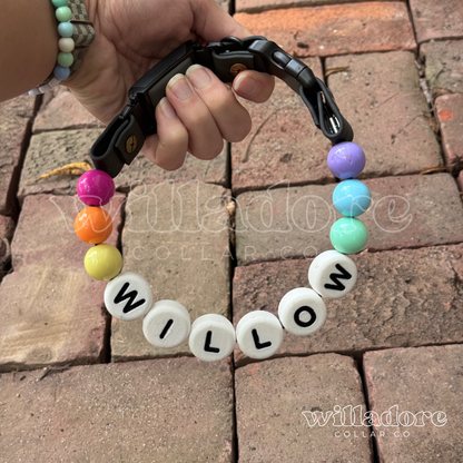 Custom beaded dog collar with rainbow beads and WILLOW name letters, showing a personalized design option for Willadore Collar Co.’s handmade beaded dog collars.