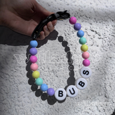 Custom beaded dog collar with pastel opal‑tone beads and BUBS name letters, showing a personalized design option for Willadore Collar Co.’s handmade beaded dog collars