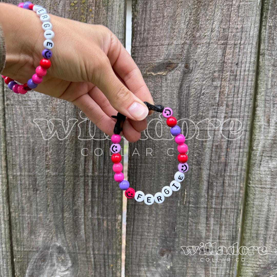 Custom beaded pet collar with pink, red, purple, and black beads and FERGIE name letters, showing a personalized design option for Willadore Collar Co.’s handmade beaded collars.