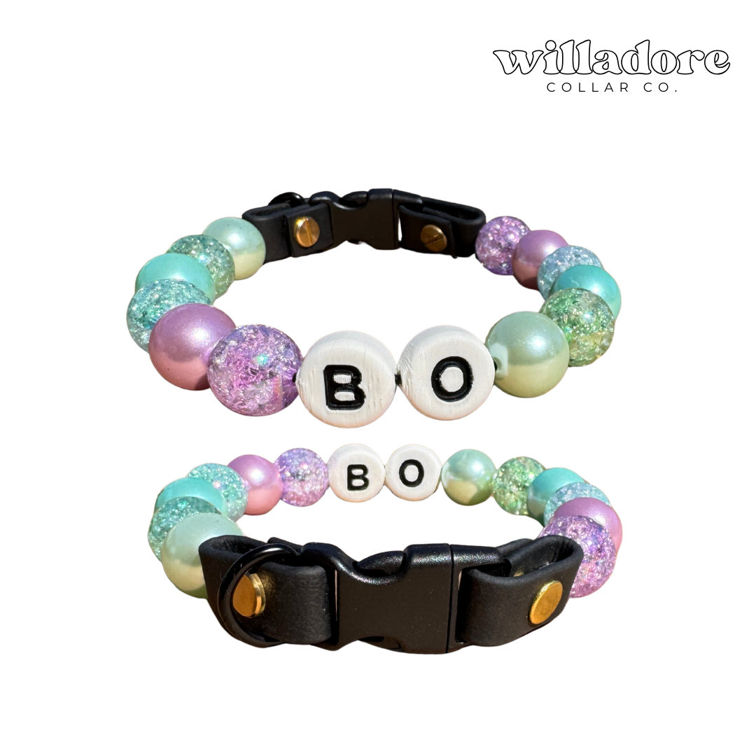 Two custom beaded dog collars with pastel and glitter beads and BOBO name letters, showing a personalized design option for Willadore Collar Co.’s handmade beaded dog collars.